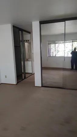 a bathroom with a sink a mirror and vanity