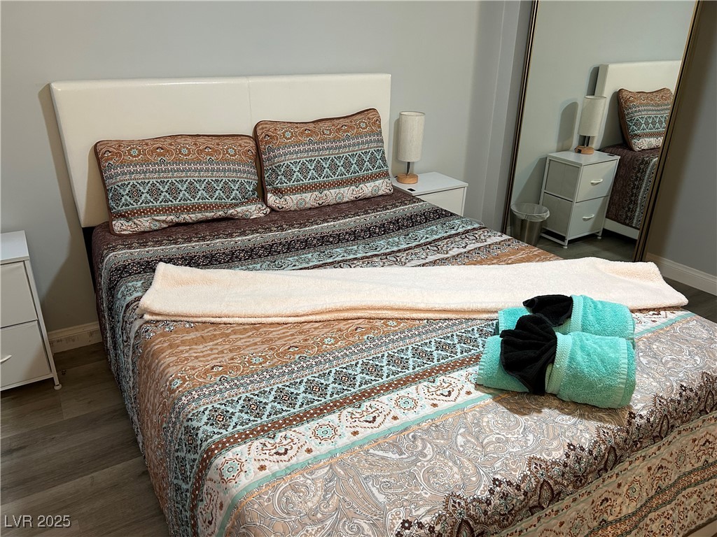 5045 Spencer Street, Unit B Las Vegas, NV 89119 - Photo 11 of 23 Bedroom with wood finished floors
