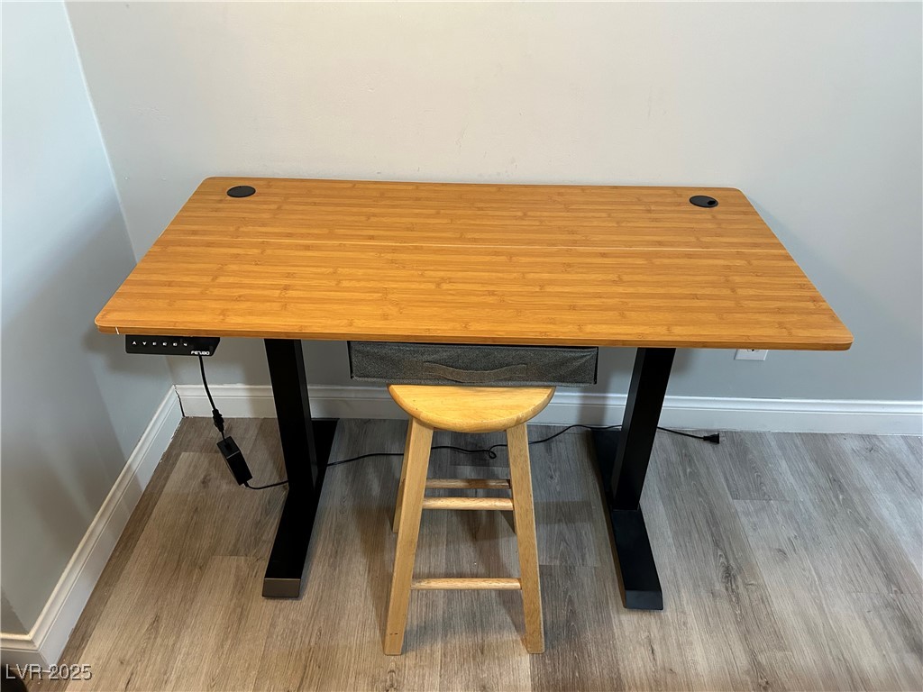 5045 Spencer Street, Unit B Las Vegas, NV 89119 - Photo 18 of 23 Office view of baseboards and wood finished floors