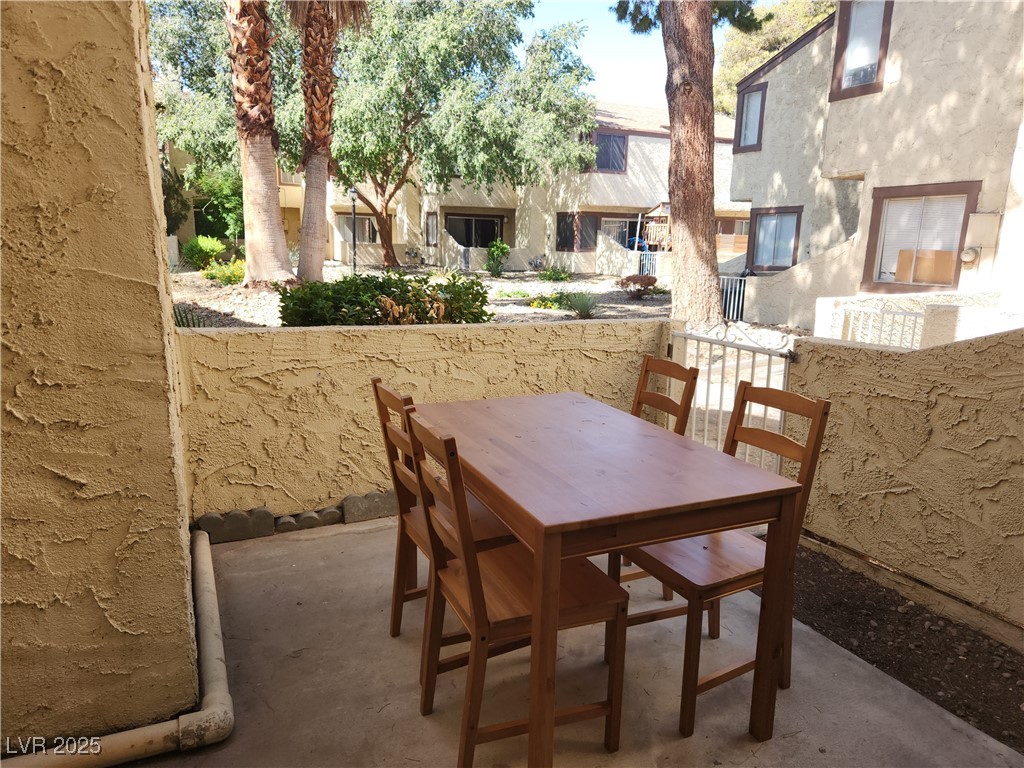 5045 Spencer Street, Unit B Las Vegas, NV 89119 - Photo 21 of 23 View of patio / terrace with outdoor dining space