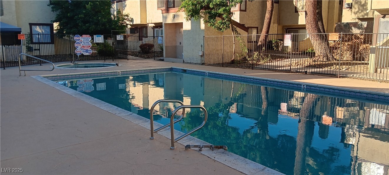 5045 Spencer Street, Unit B Las Vegas, NV 89119 - Photo 23 of 23 Community pool with a community hot tub