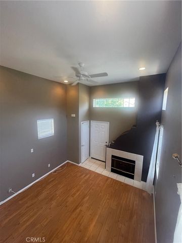 a kitchen with a white cabinets and window
