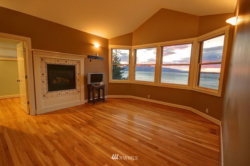 804 Fieldston Road Bellingham, WA 98225 - Photo 13 of 25 a view of an empty room with a window and wooden floor
