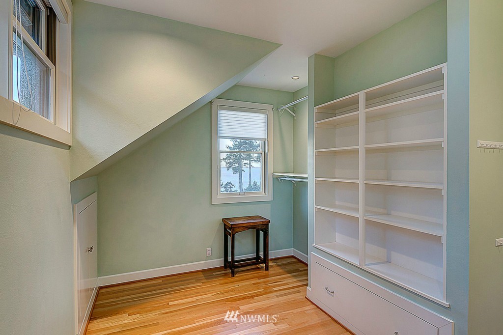 804 Fieldston Road Bellingham, WA 98225 - Photo 17 of 25 a view of a room with shelves and a book shelf