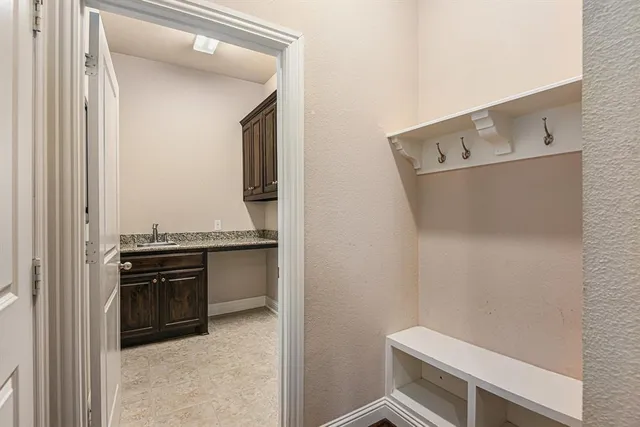 a kitchen with a stove and a refrigerator