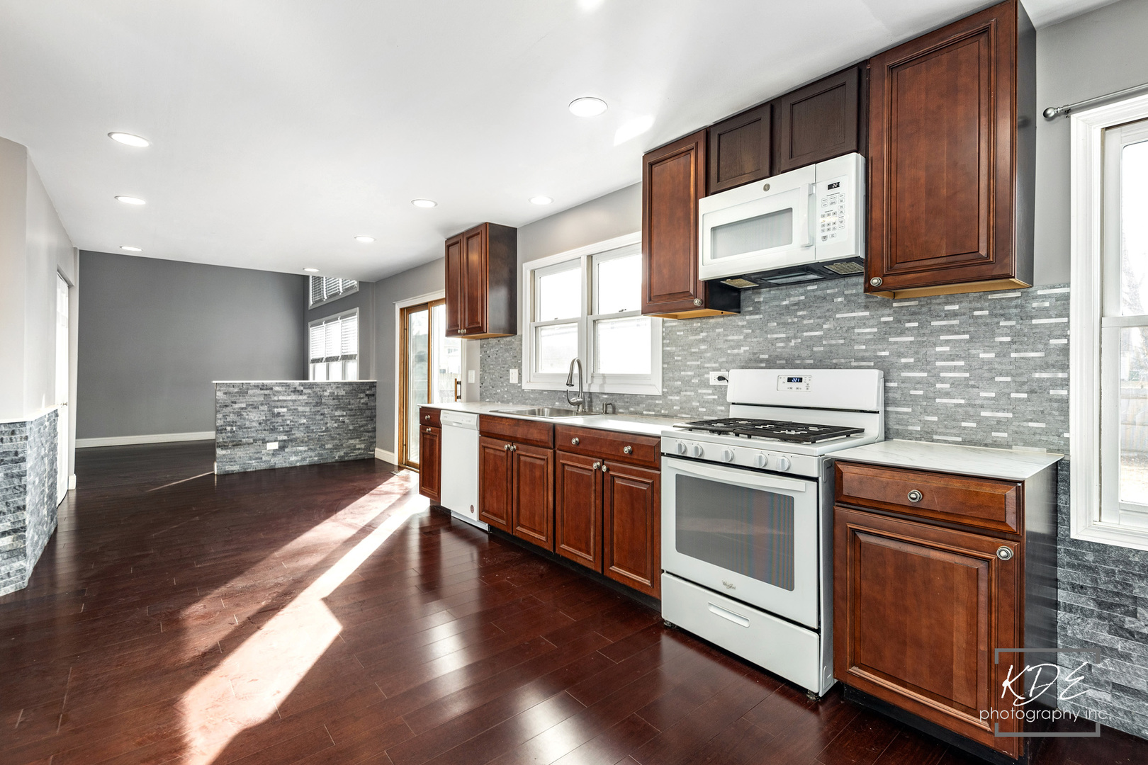 1801 Olde Mill Road Plainfield, IL 60586 - Photo 7 of 33 a kitchen with stainless steel appliances granite countertop a stove a sink and a refrigerator