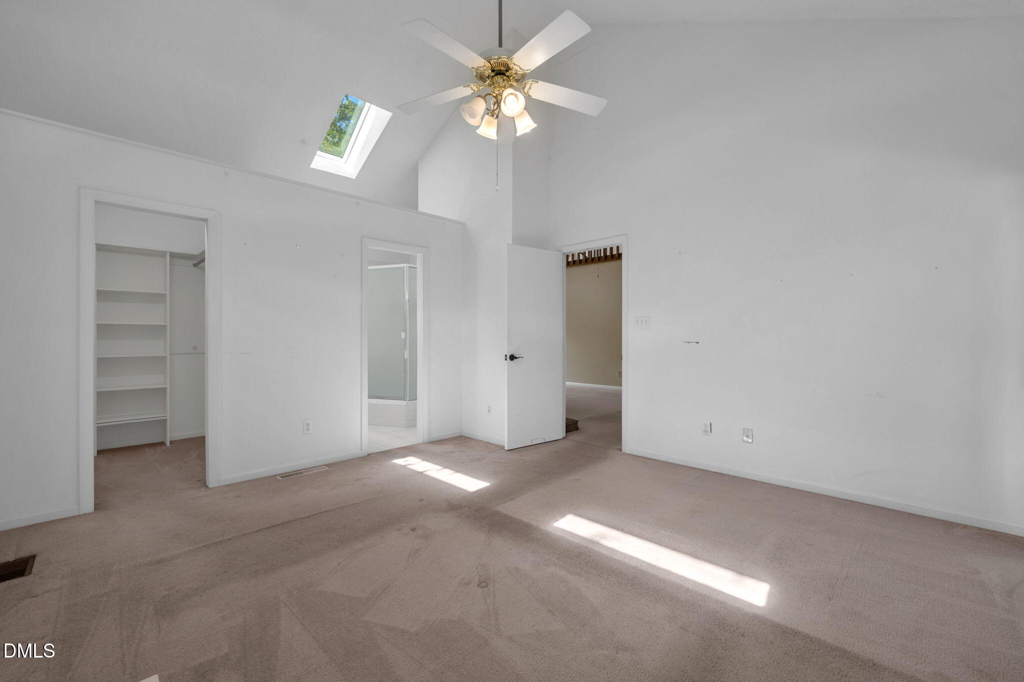 8700 Den Court Raleigh, NC 27615 - Photo 15 of 43 an empty room with closet and a chandelier fan