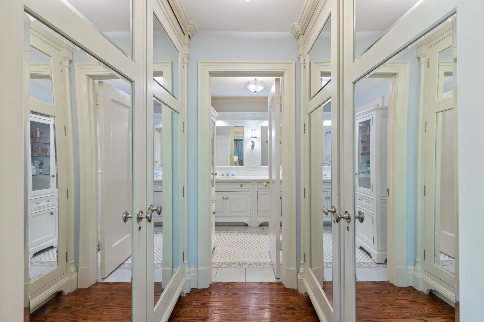 600 Ash Street Winnetka, IL 60093 - Photo 14 of 30 a view of a hallway with wooden floor and a bathroom