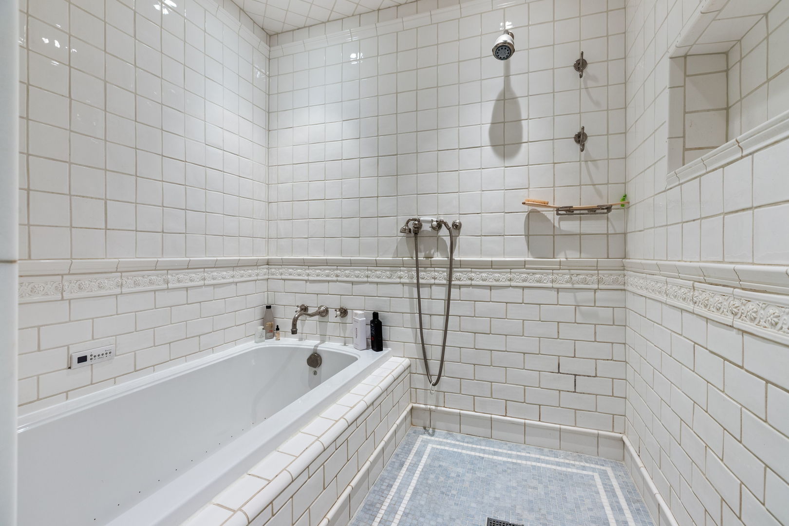 600 Ash Street Winnetka, IL 60093 - Photo 16 of 30 a bathroom with a bathtub and shower