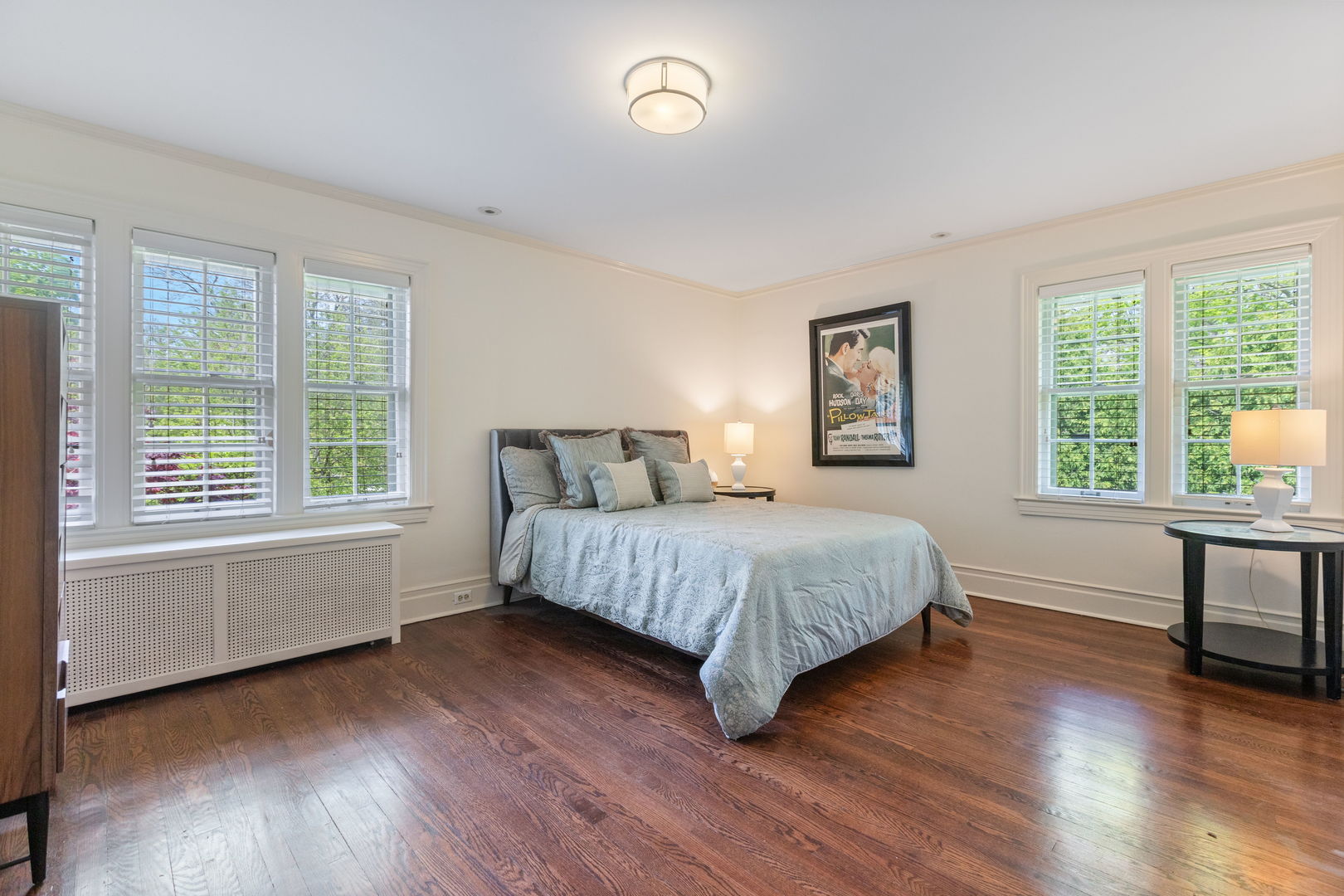 600 Ash Street Winnetka, IL 60093 - Photo 20 of 30 a bedroom with a bed and a chair next to a window