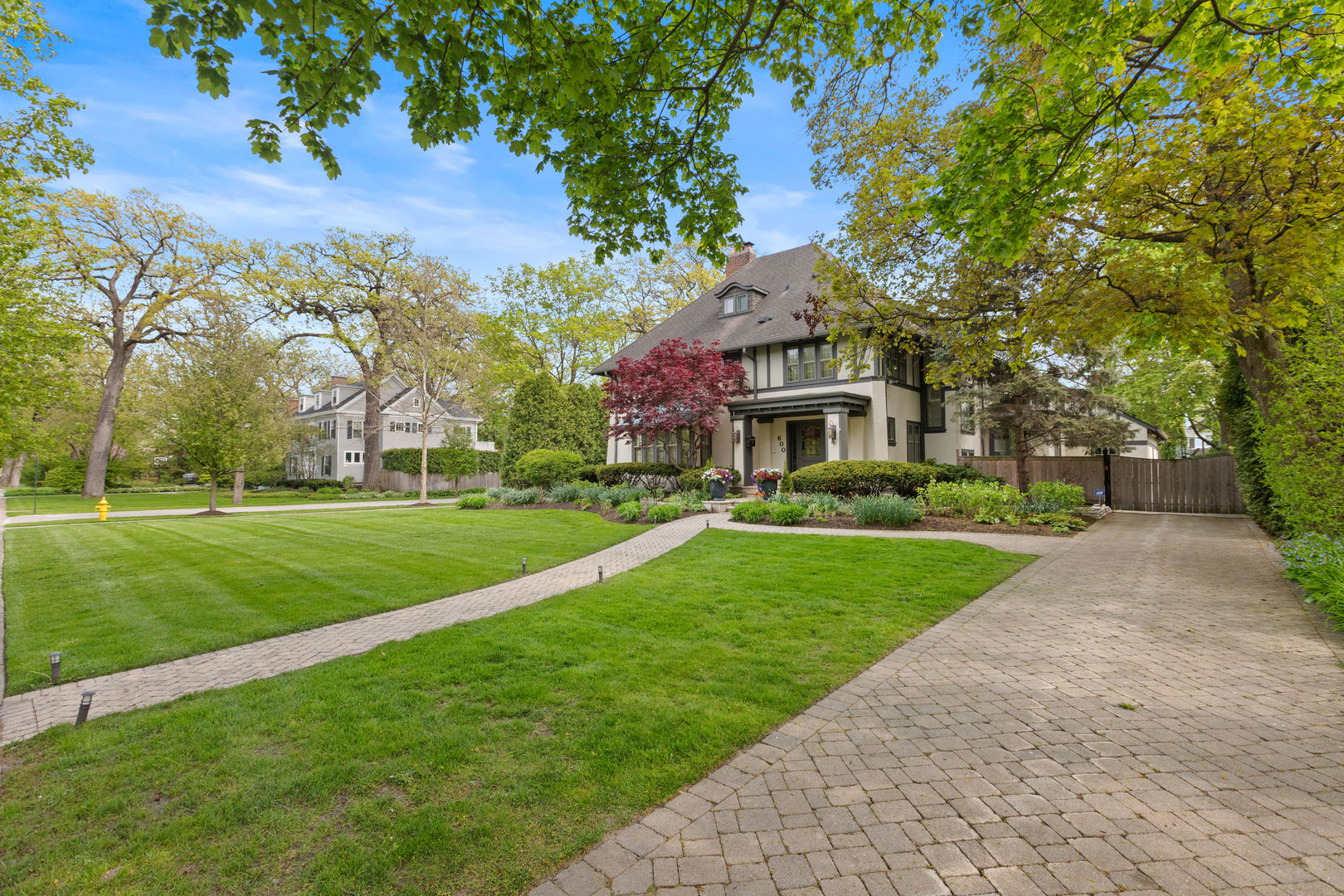 600 Ash Street Winnetka, IL 60093 - Photo 2 of 30 a front view of house with yard and green space