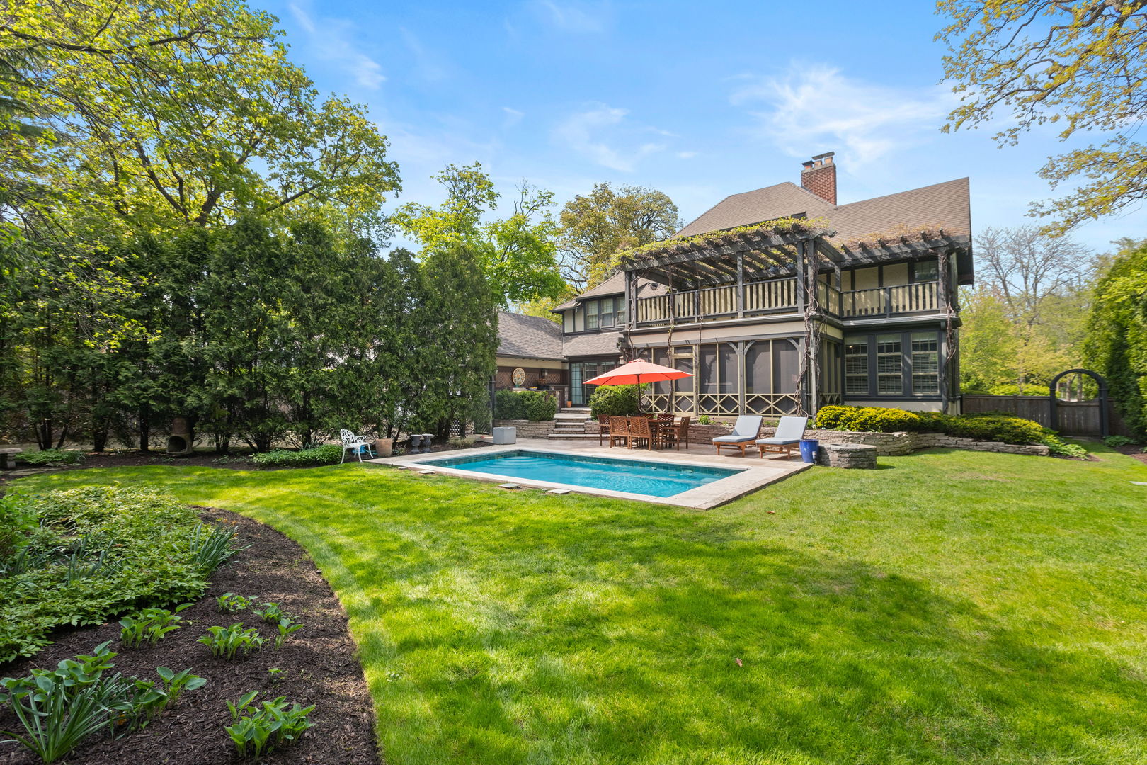 600 Ash Street Winnetka, IL 60093 - Photo 24 of 30 a view of a house with swimming pool yard patio and fire pit
