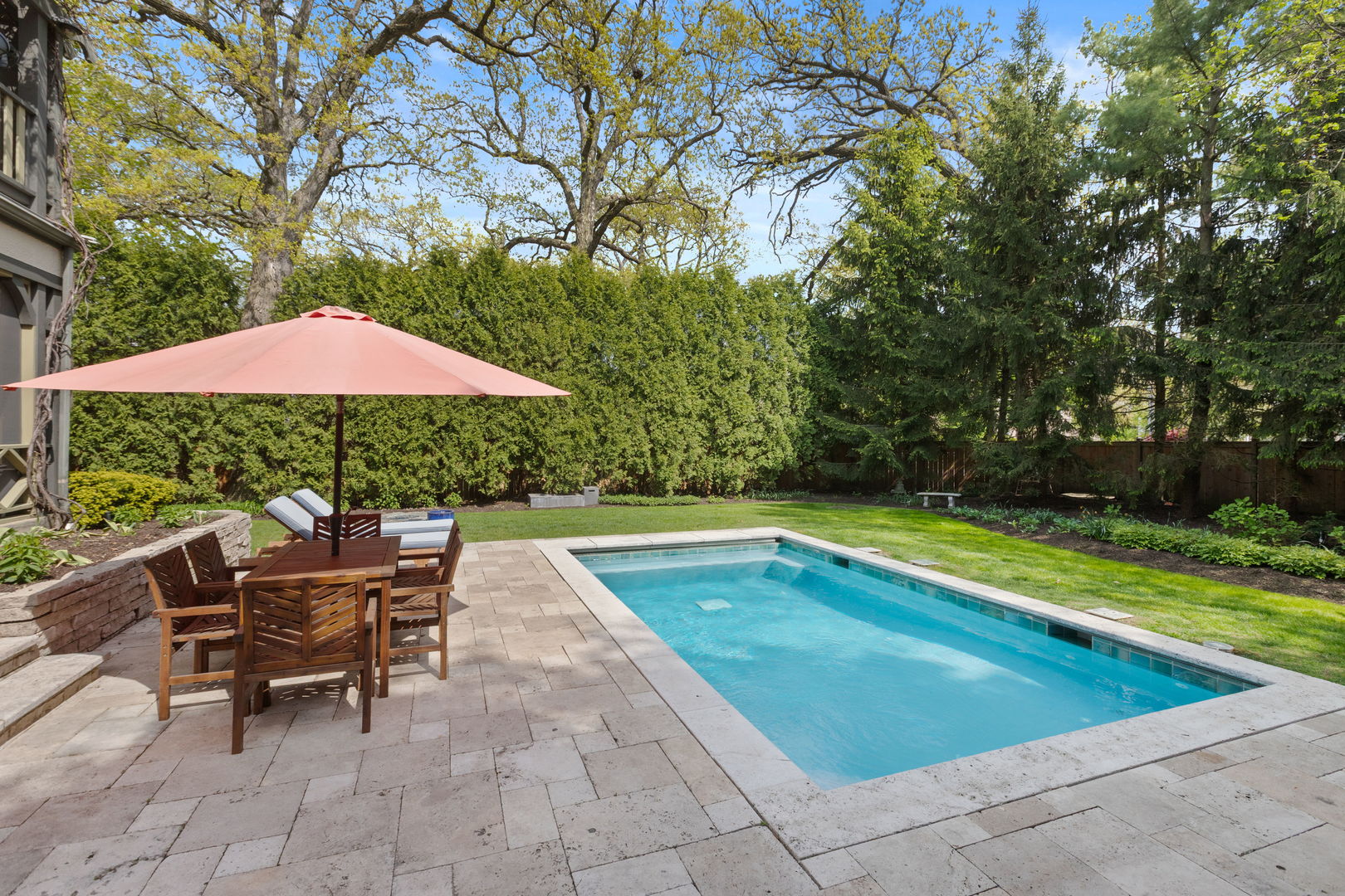 600 Ash Street Winnetka, IL 60093 - Photo 25 of 30 a swimming pool with outdoor seating and yard