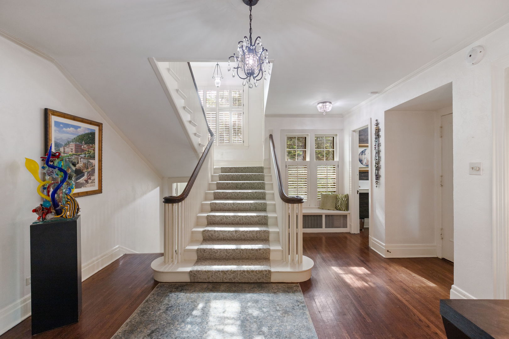 600 Ash Street Winnetka, IL 60093 - Photo 3 of 30 a view of entryway with wooden floor and stairs