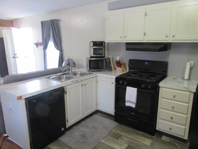 3251 E Road, Unit 99 Clifton, CO 81520 - Photo 16 of 25 a kitchen with cabinets appliances and a sink