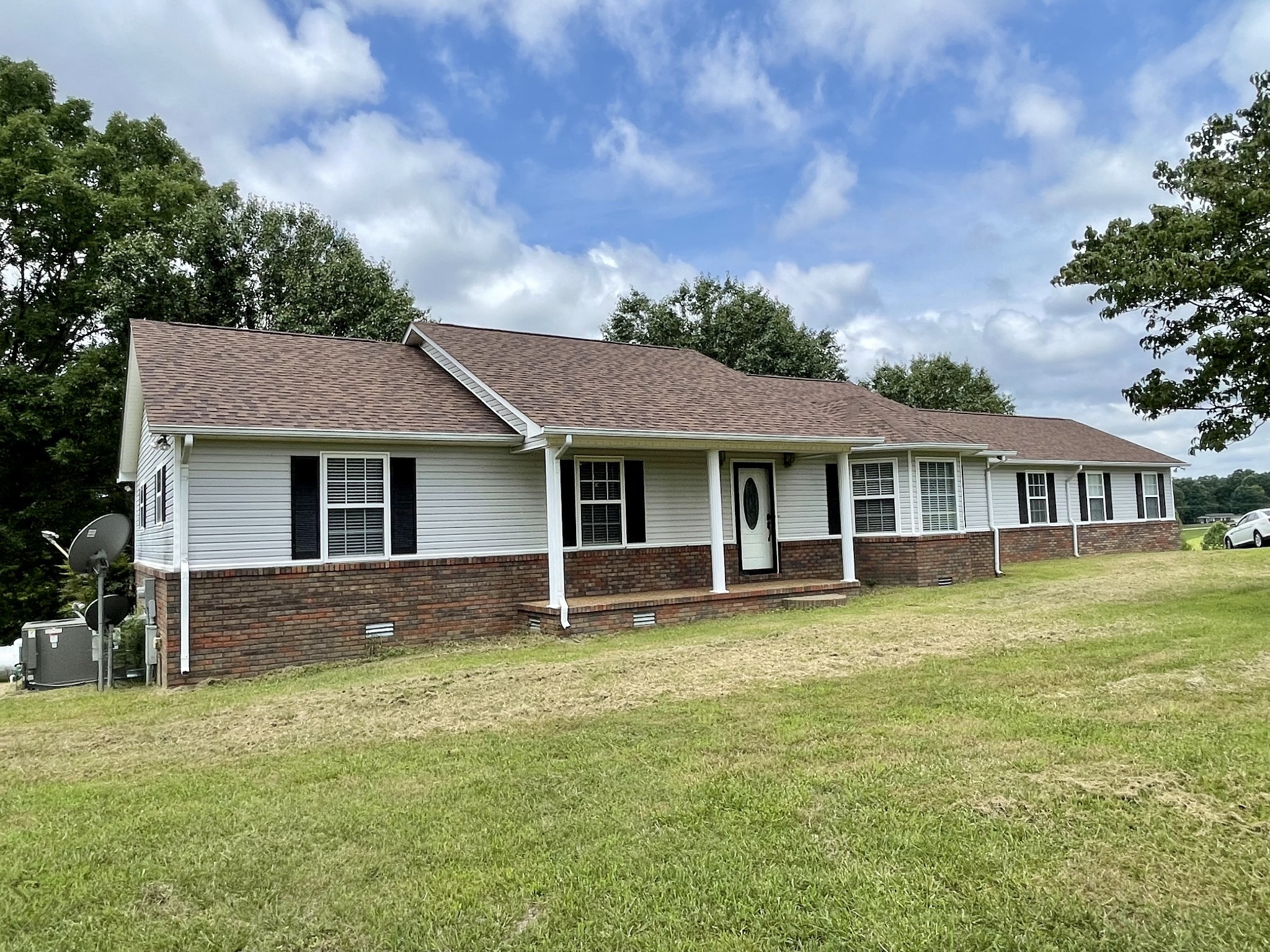 1213 West Point Road Lawrenceburg, TN 38464 - Photo 1 of 37 a view of a house with a swimming pool and a yard