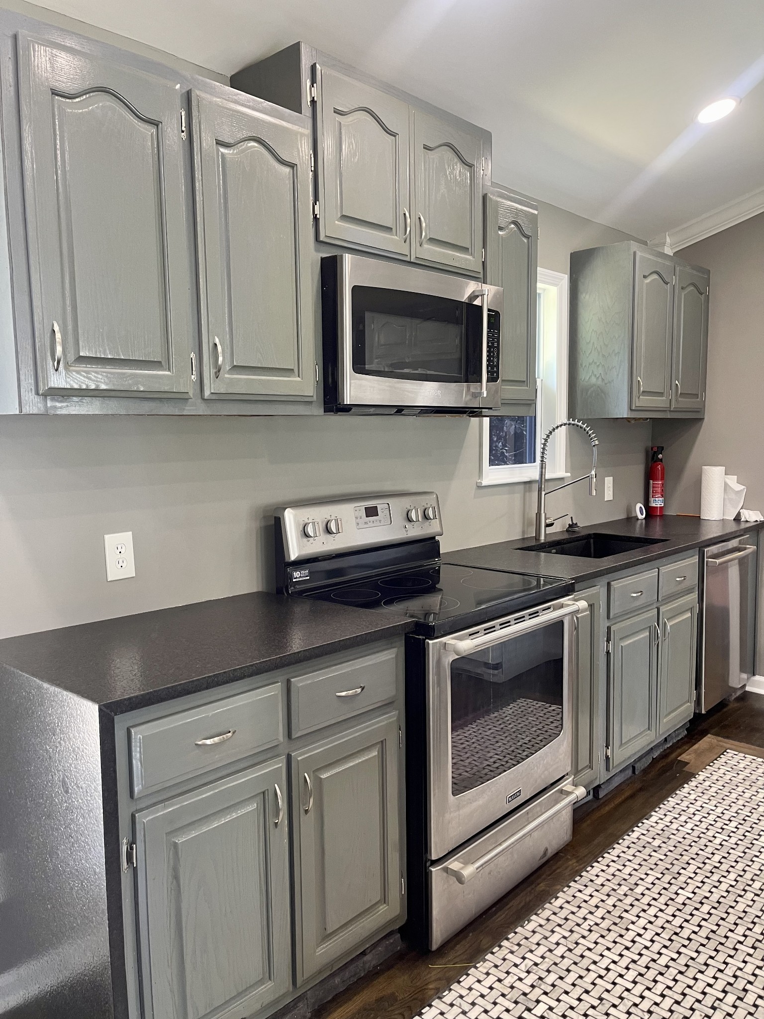 1213 West Point Road Lawrenceburg, TN 38464 - Photo 13 of 37 a kitchen with granite countertop white cabinets stainless steel appliances and sink