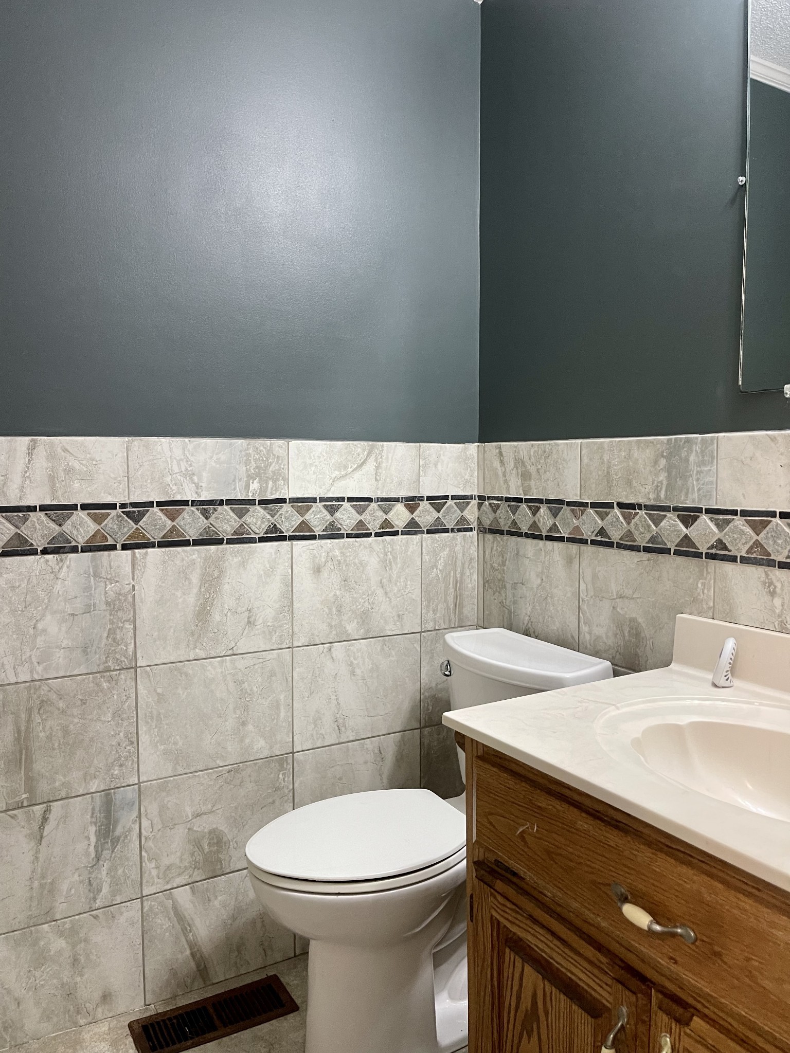 1213 West Point Road Lawrenceburg, TN 38464 - Photo 22 of 37 a bathroom with a sink a toilet and a mirror