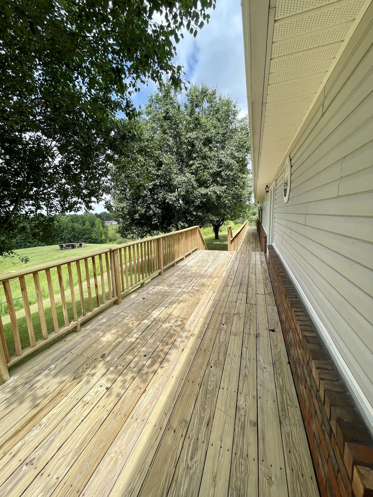 1213 West Point Road Lawrenceburg, TN 38464 - Photo 32 of 37 a view of balcony with wooden floor and fence