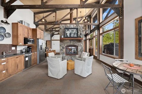 a swimming pool with outdoor seating and trees