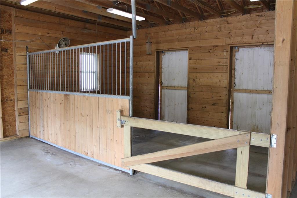 516 Kansas Road Milbridge, ME 04658 - Photo 9 of 34 Horse stall with opening doors...