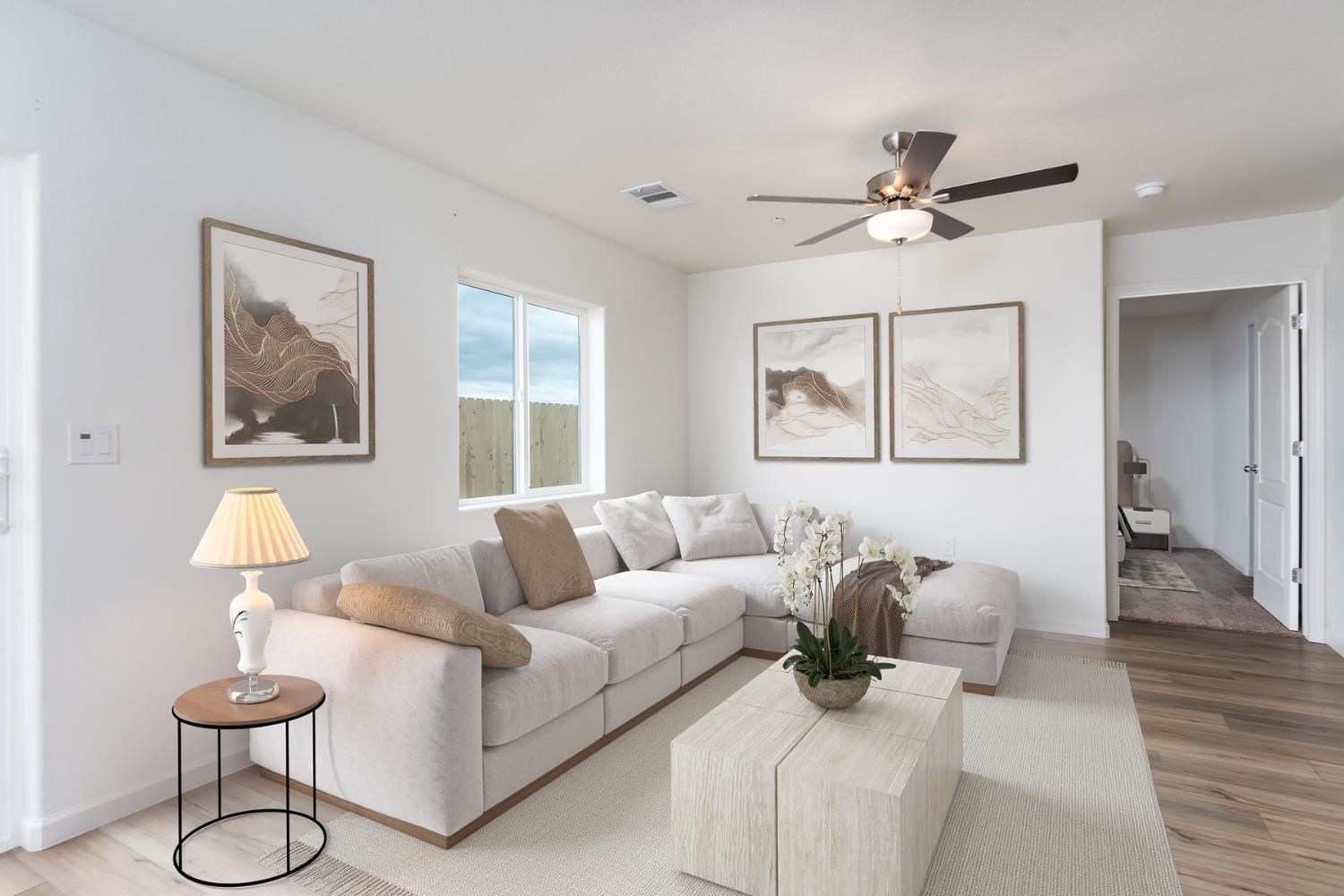 2265 Travis Court Newman, CA 95360 - Photo 7 of 12 a living room with furniture and a lamp
