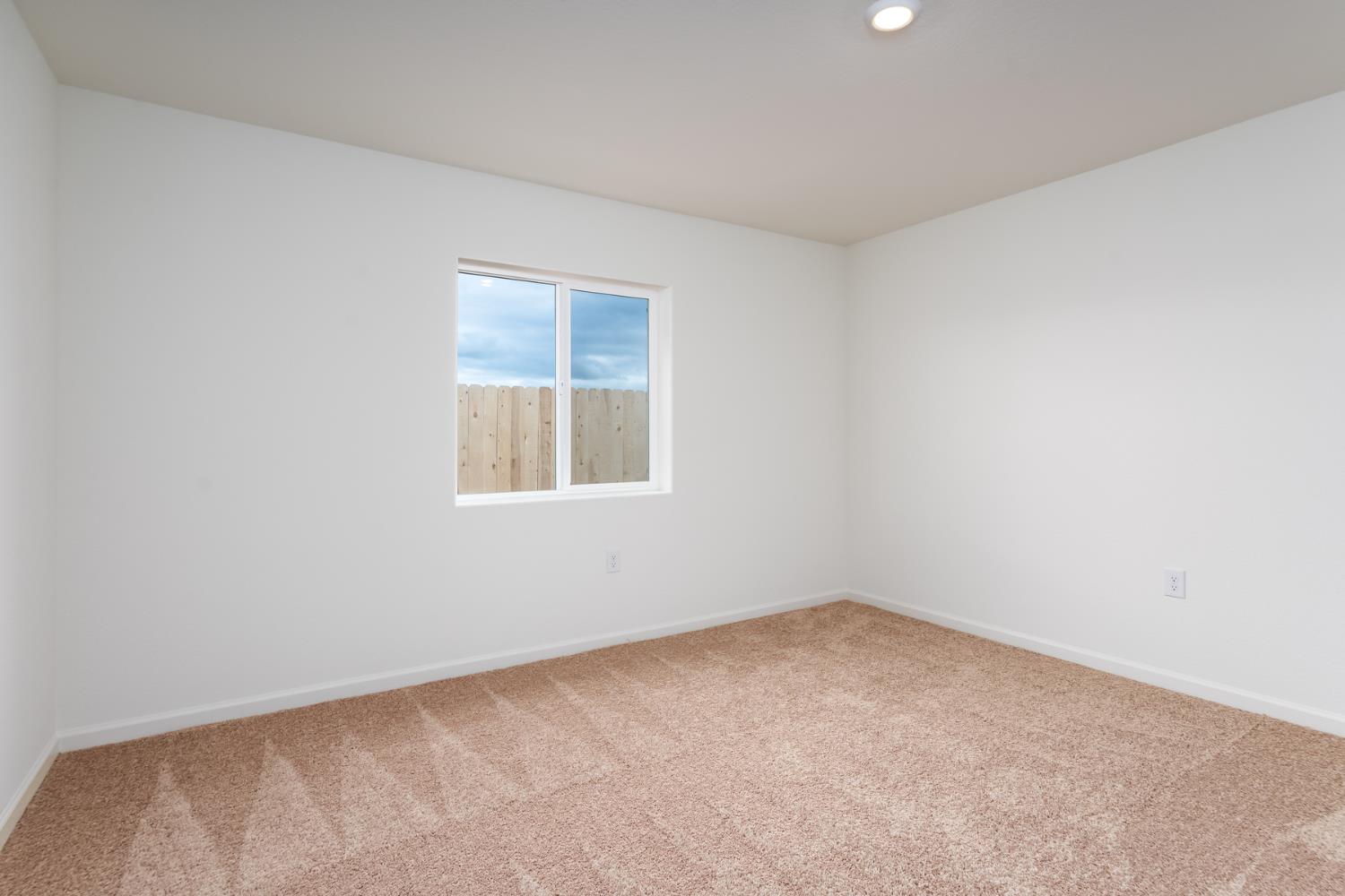 2265 Travis Court Newman, CA 95360 - Photo 8 of 12 an empty room with a window