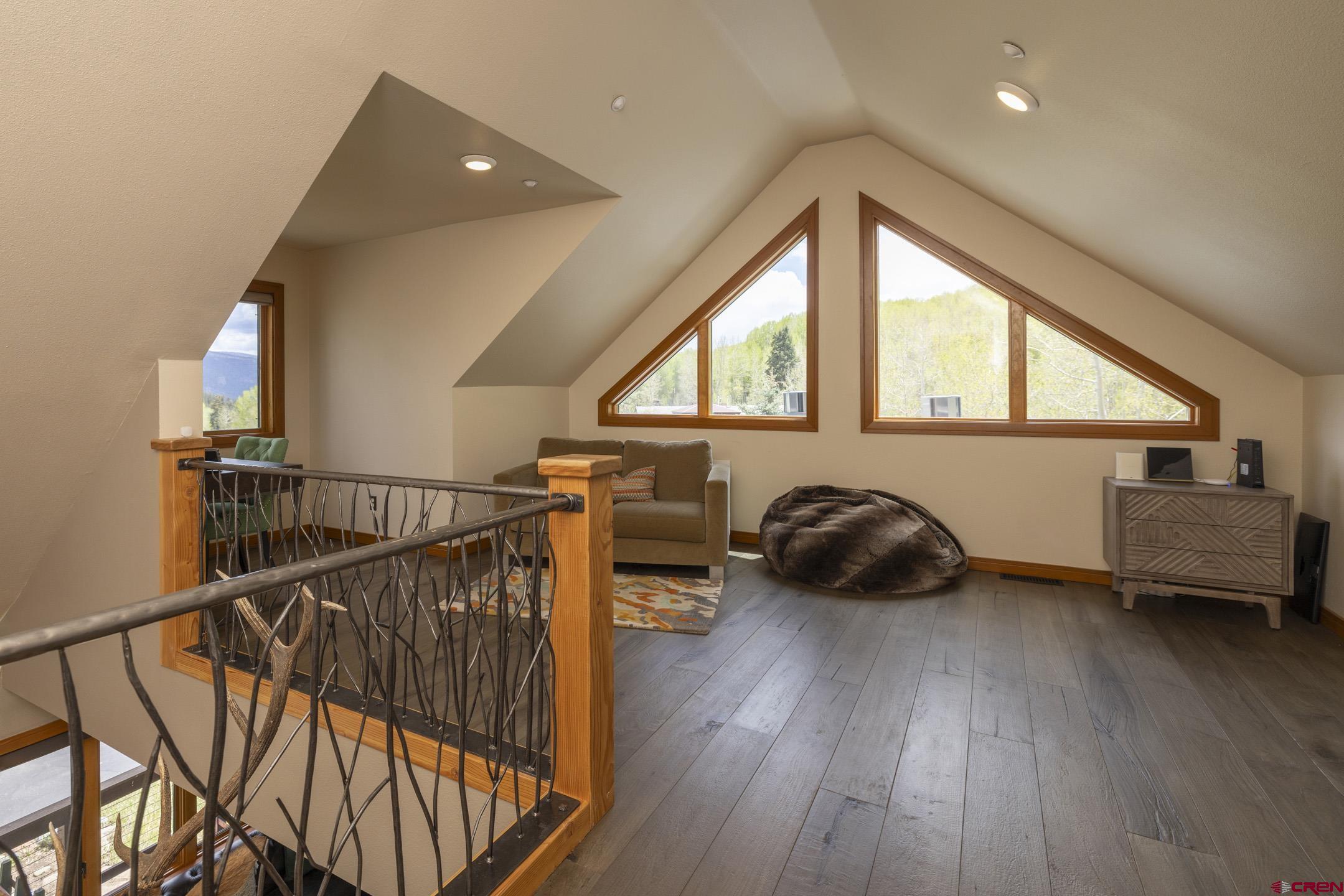 154 Falcon Ridge Road Durango, CO 81301 - Photo 26 of 42 a bedroom with furniture and a window