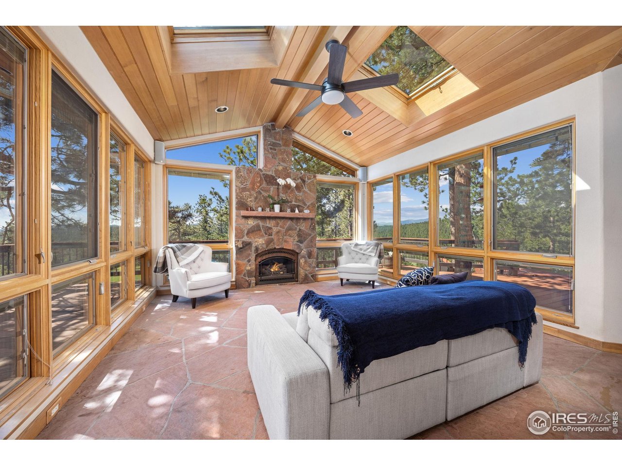 208 Coughlin Meadows Road Boulder, CO 80302 - Photo 16 of 50 Sunroom with skylights and removable glass walls that bring the outdoors in