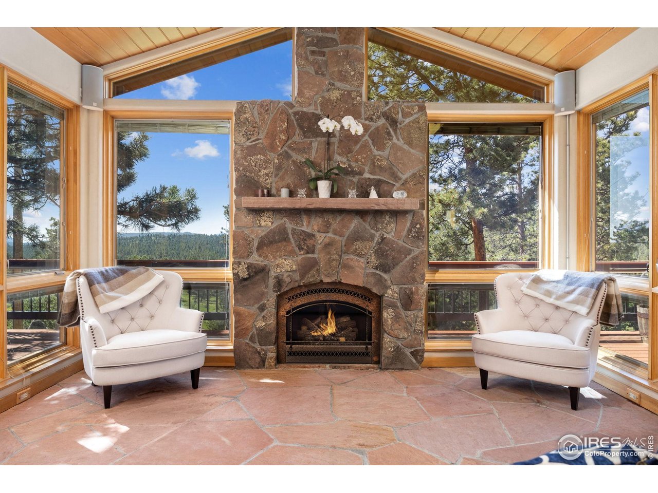 208 Coughlin Meadows Road Boulder, CO 80302 - Photo 17 of 50 Cozy ambiance in this space with heated floors and gas fireplace