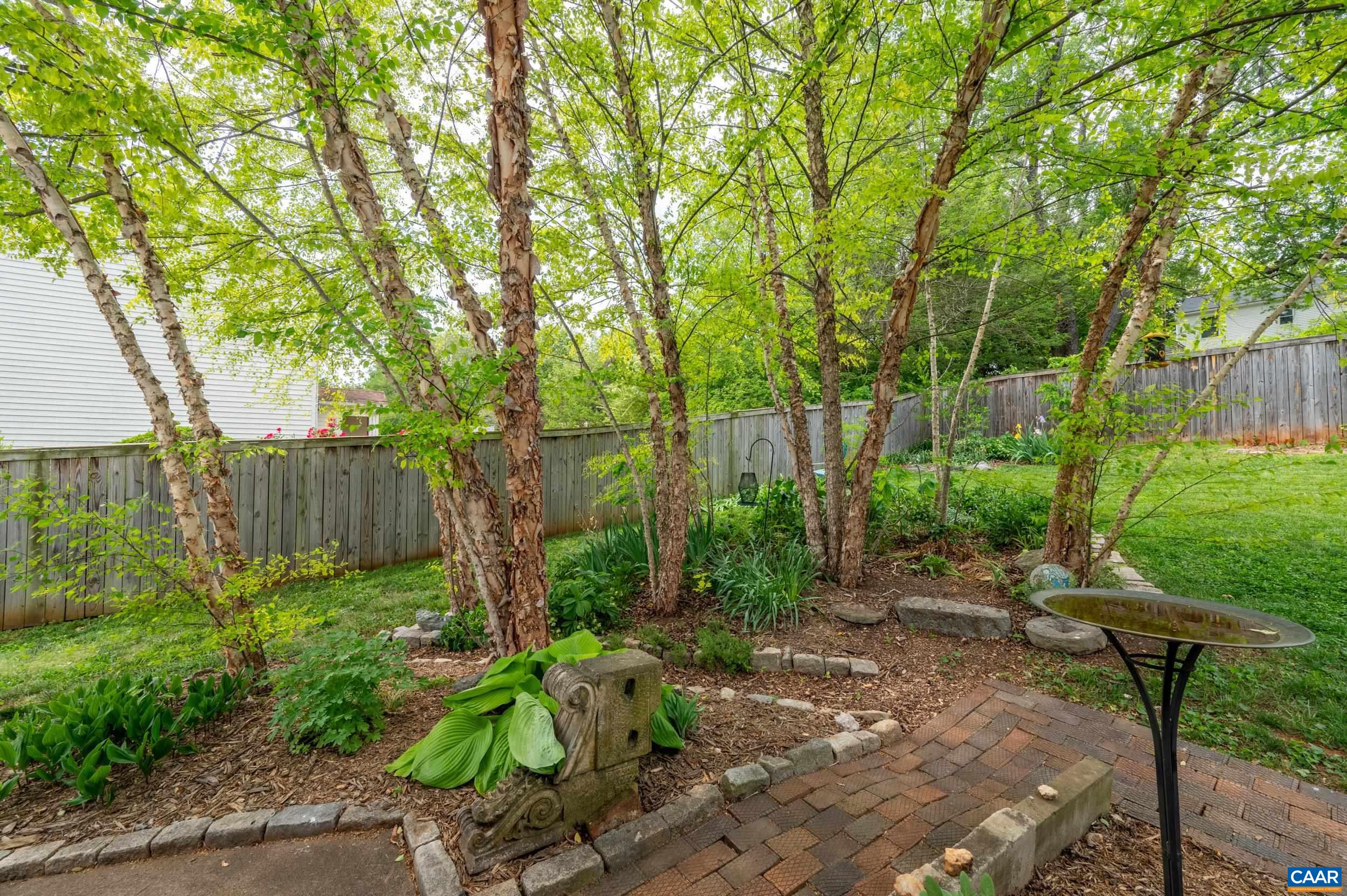 423 Meade Avenue Charlottesville, VA 22902 - Photo 38 of 47 a view of backyard with table and chairs and wooden fence