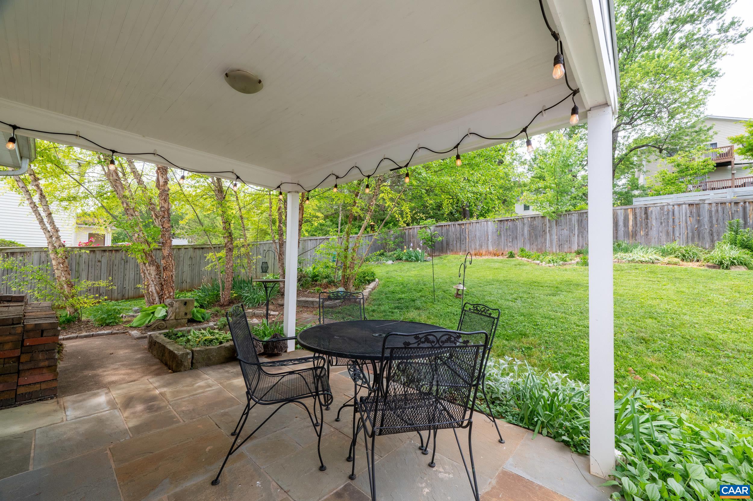 423 Meade Avenue Charlottesville, VA 22902 - Photo 42 of 47 a backyard of a house with table and chairs
