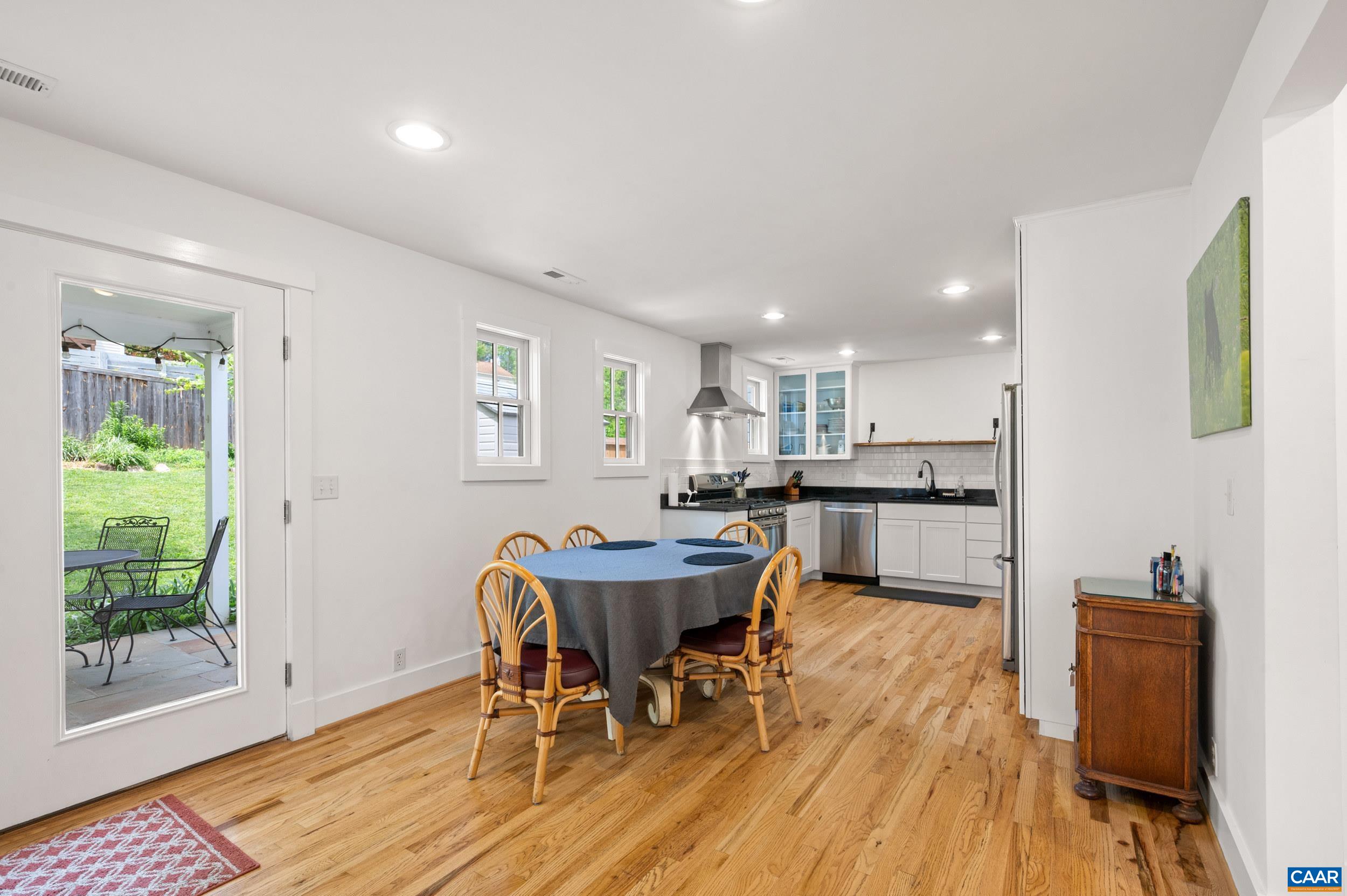 423 Meade Avenue Charlottesville, VA 22902 - Photo 6 of 47 a view of a dining room with furniture and wooden floor