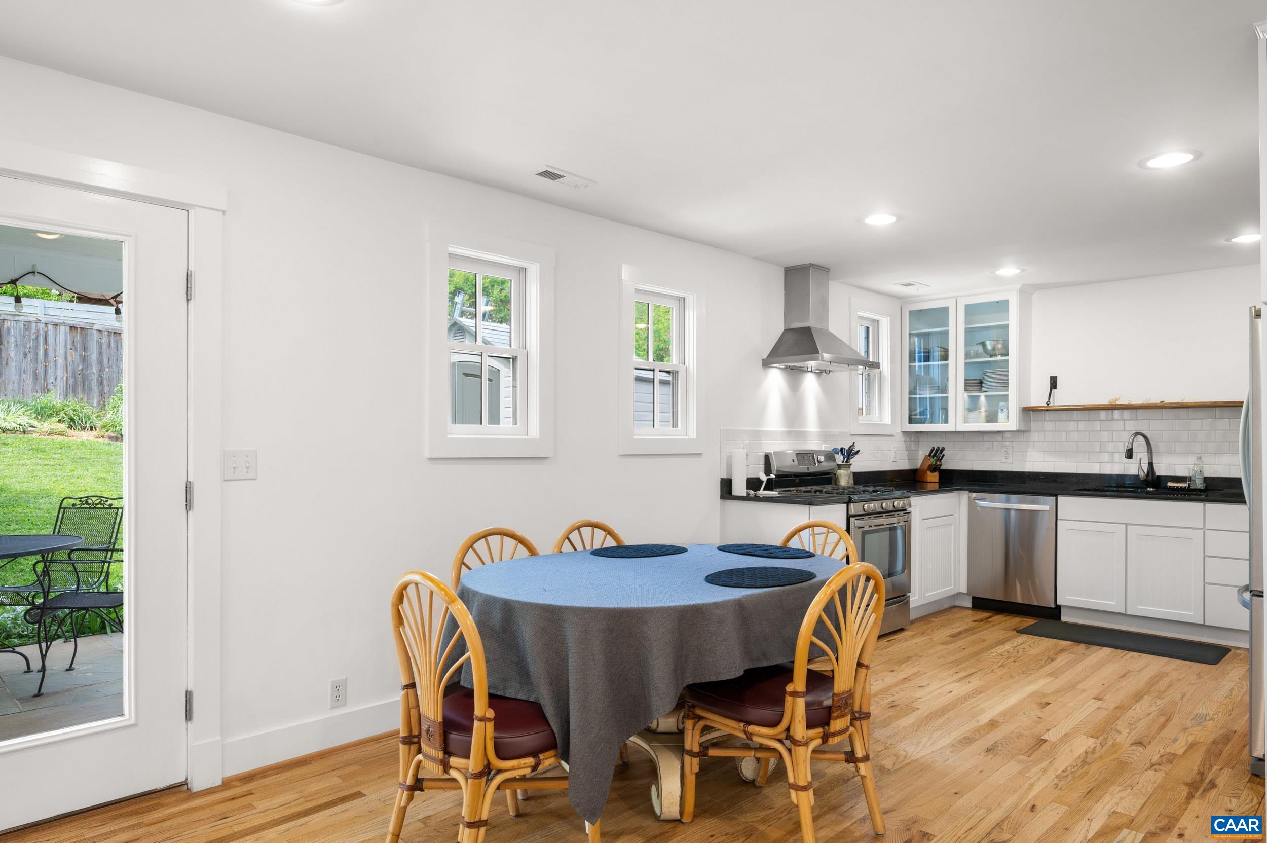 423 Meade Avenue Charlottesville, VA 22902 - Photo 7 of 47 a view of a dining room with furniture and wooden floor