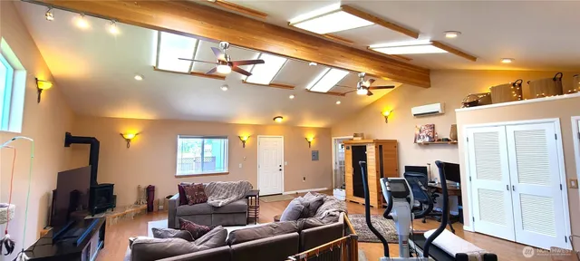 a bedroom with bed and a window