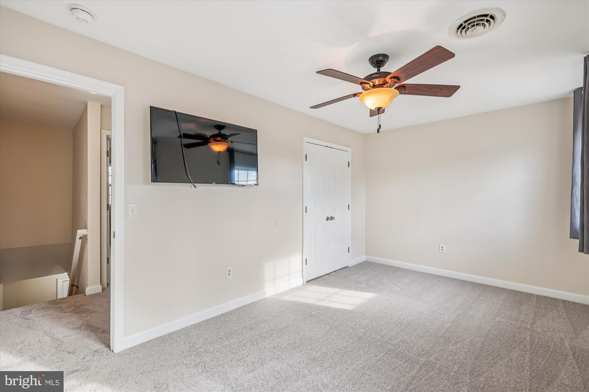 209 Webb Lane St. Michaels, MD 21663 - Photo 29 of 33 wooden floor in an empty room with a window