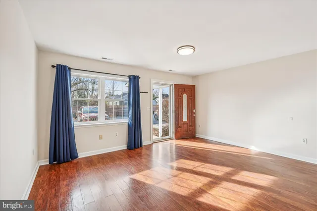 a bed room with a bed and a large window