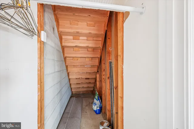 a view of walk in closet with clothes
