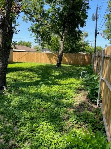 a view of backyard with swimming pool and outdoor seating
