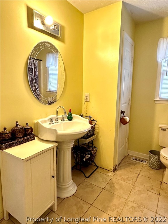 1597 Wade-Stedman Road Stedman, NC 28391 - Photo 11 of 25 a bathroom with a sink and a mirror