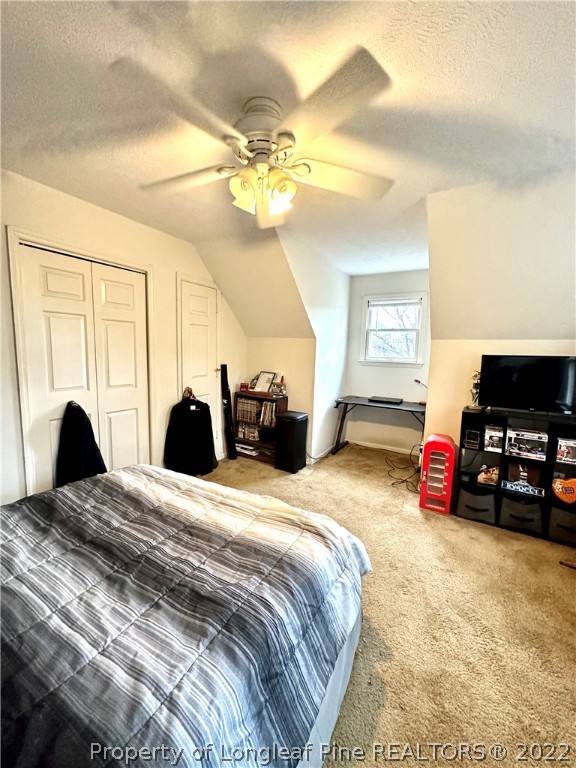 1597 Wade-Stedman Road Stedman, NC 28391 - Photo 15 of 25 a bedroom with a bed and a couch