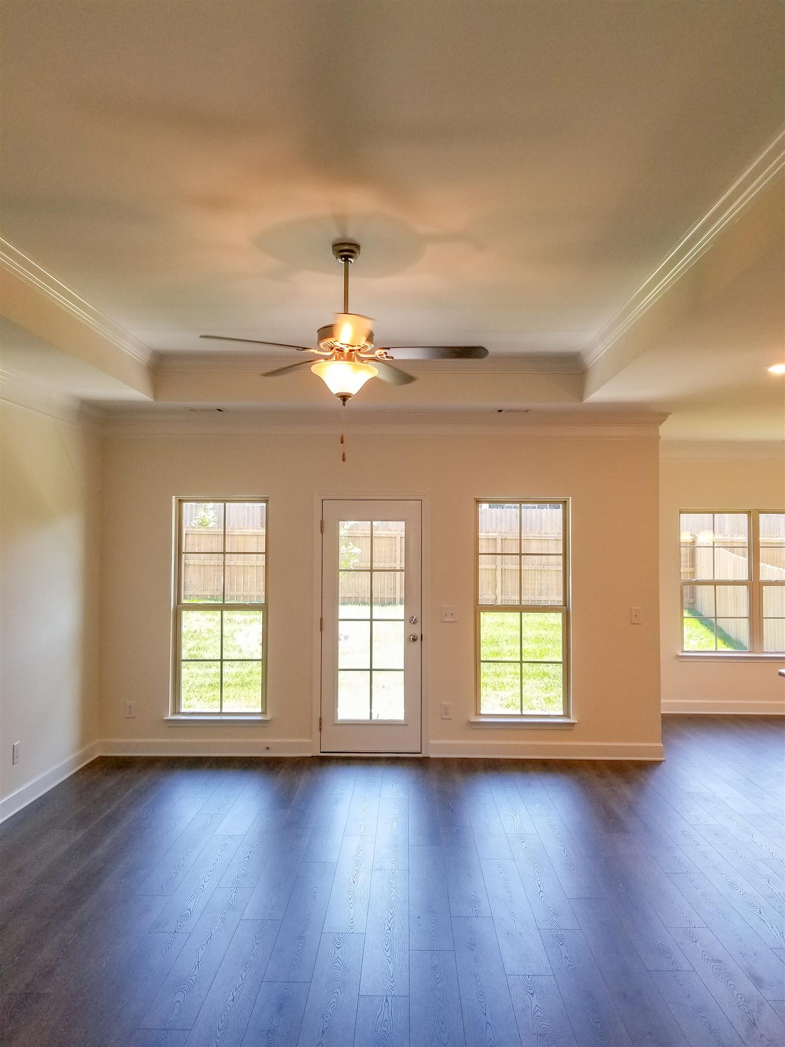 403 Butler Road Mount Juliet, TN 37122 - Photo 3 of 24 an empty room with wooden floor chandelier and windows