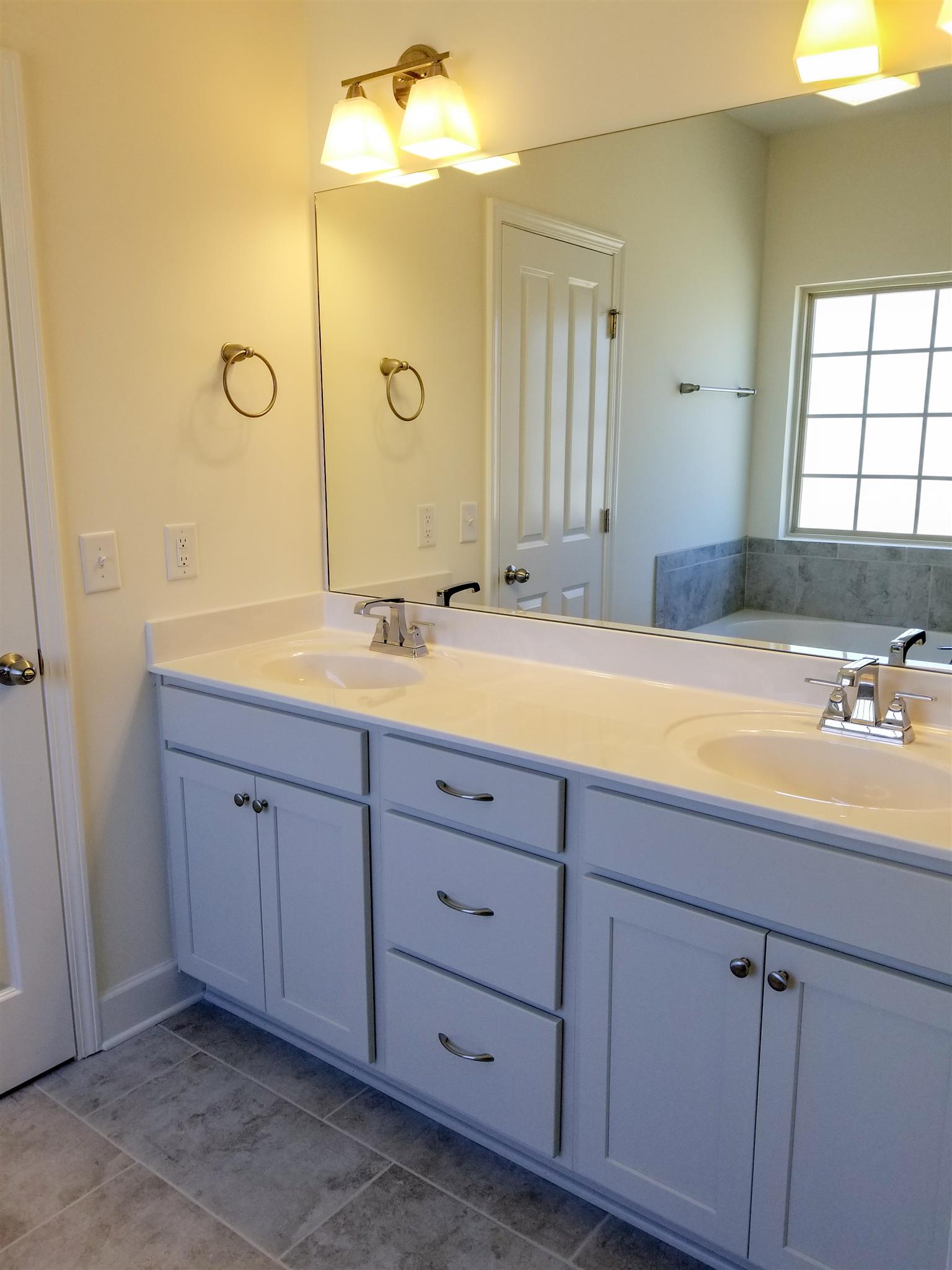 403 Butler Road Mount Juliet, TN 37122 - Photo 22 of 24 a bathroom with a double vanity sink and mirror