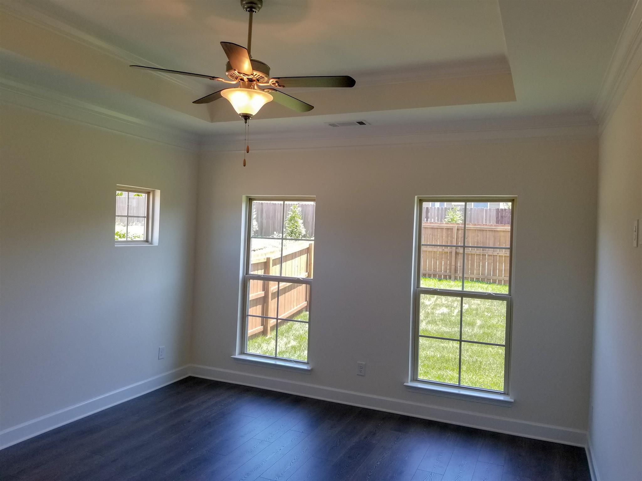 403 Butler Road Mount Juliet, TN 37122 - Photo 23 of 24 a view of an empty room with wooden floor and a window