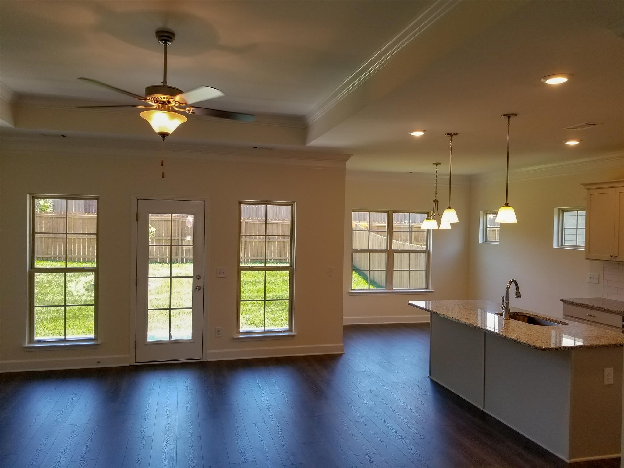 403 Butler Road Mount Juliet, TN 37122 - Photo 4 of 24 a view of a room with wooden floor and a ceiling fan
