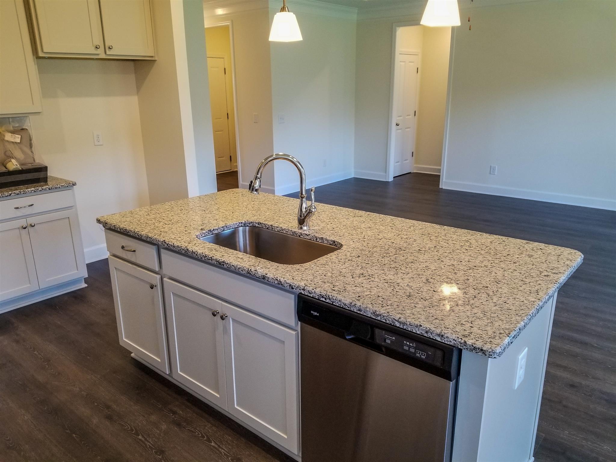 403 Butler Road Mount Juliet, TN 37122 - Photo 8 of 24 a kitchen with granite countertop a sink and cabinets