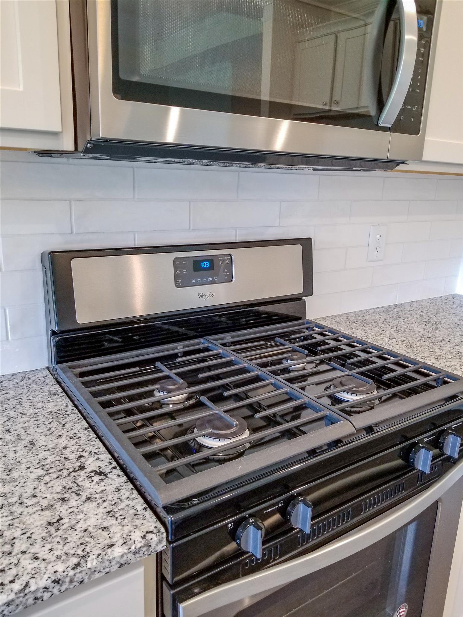 403 Butler Road Mount Juliet, TN 37122 - Photo 10 of 24 a stove sitting inside of a kitchen with granite countertops