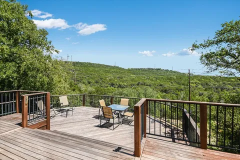 a view of a balcony with furniture