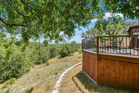 a balcony with trees in front of it