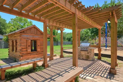 swimming pool view with a seating space
